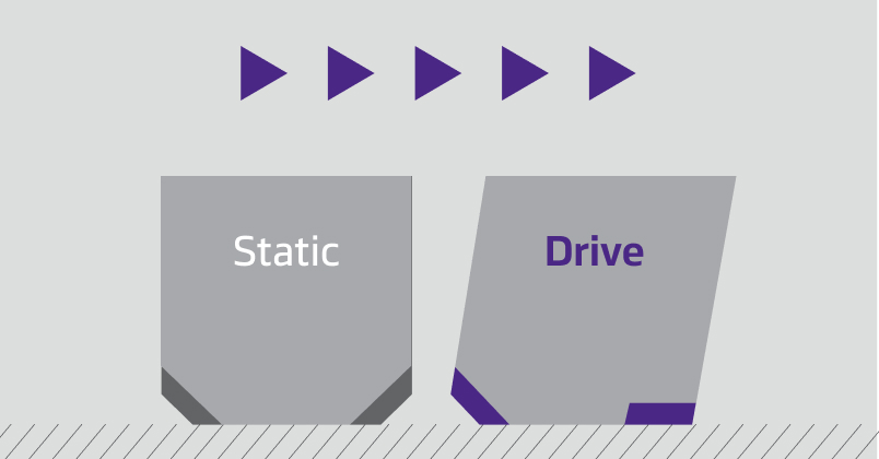 Close-up of a tire with tread blocks showing stepped shoulder edges for improved traction on both on and off-road surfaces
